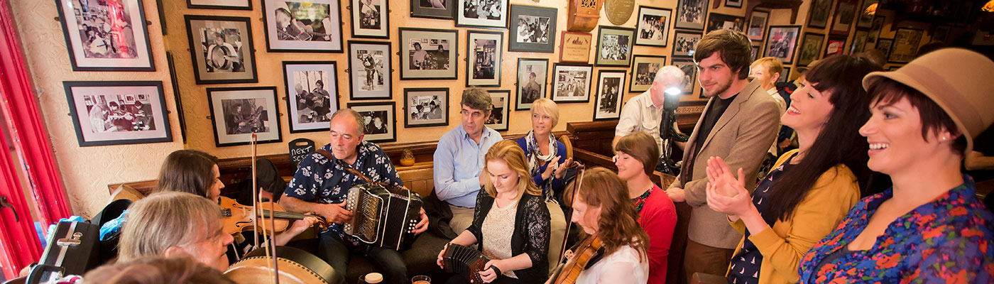 Audience watching an Irish pub band perform
